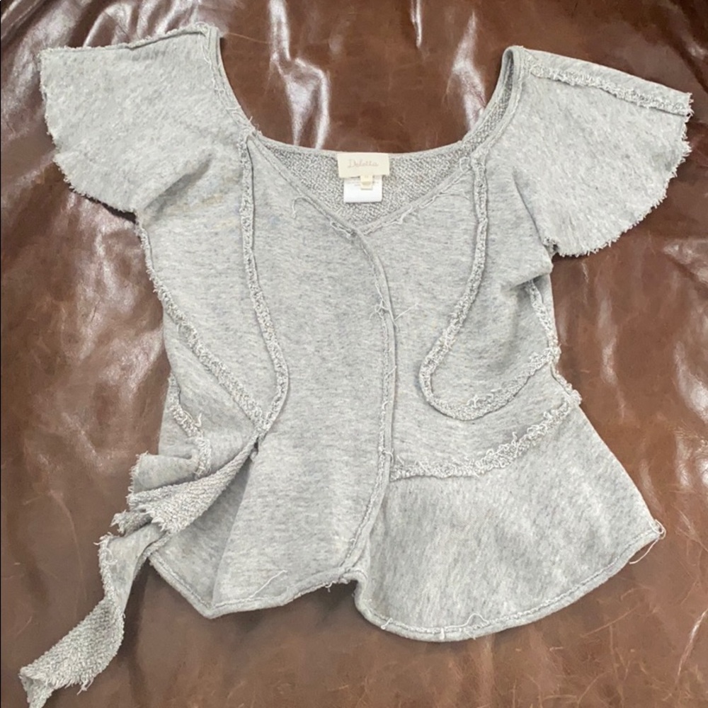 Unique fun, flirty and comfy Anthropologie top.